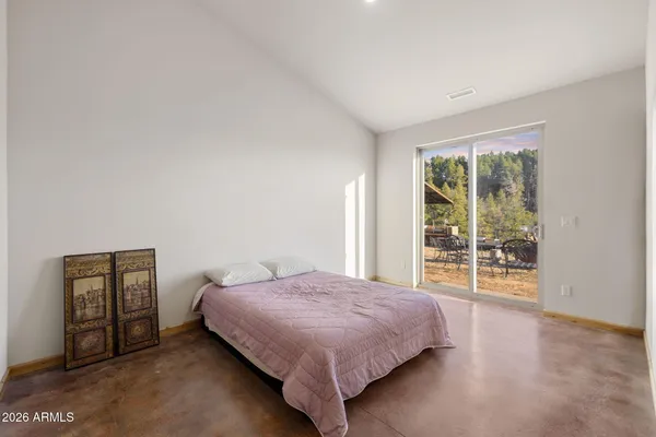 a kitchen with stainless steel appliances granite countertop a refrigerator a stove and a wooden floors