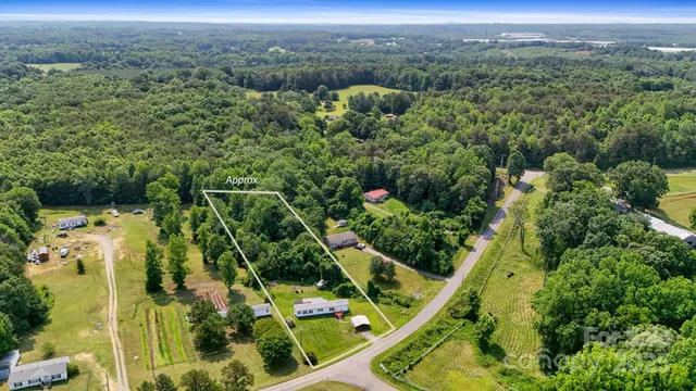 an aerial view of houses with yard