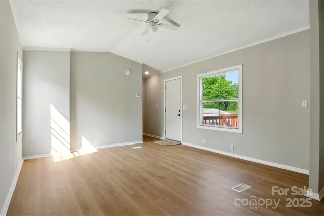 a view of an empty room with a window