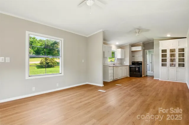 an empty room with windows and entrance