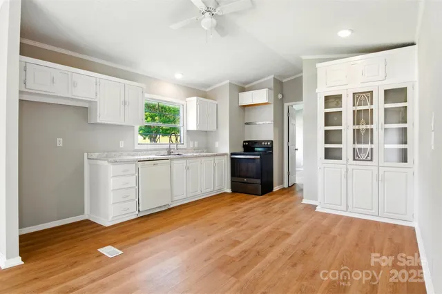 a kitchen with a refrigerator and window
