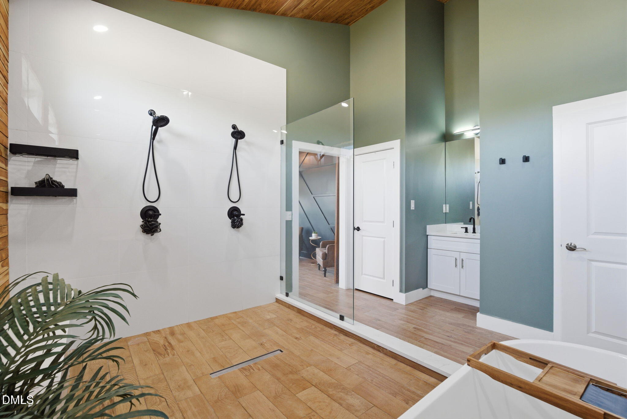 5416 Pulley Town Road Zebulon, NC 27597 - Photo 64 of 74 a bedroom with a bed and a chandelier