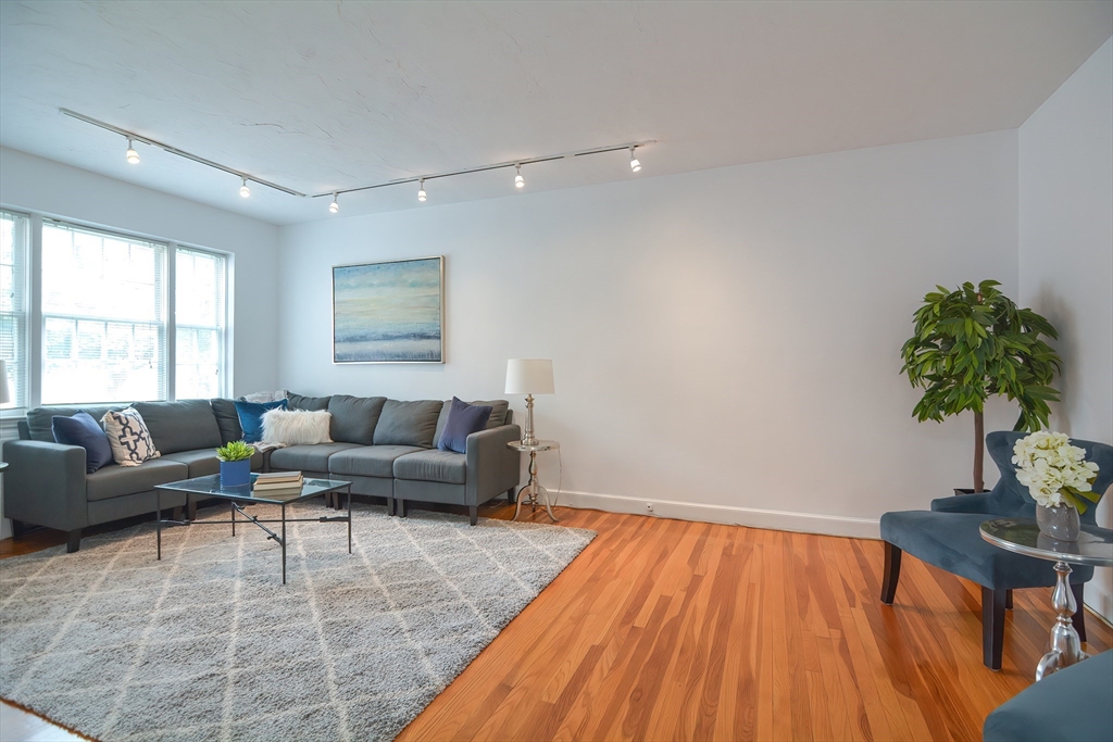 40 Browne Street, Unit 5 Brookline, MA 02446 - Photo 18 of 39 a living room with furniture and a potted plant