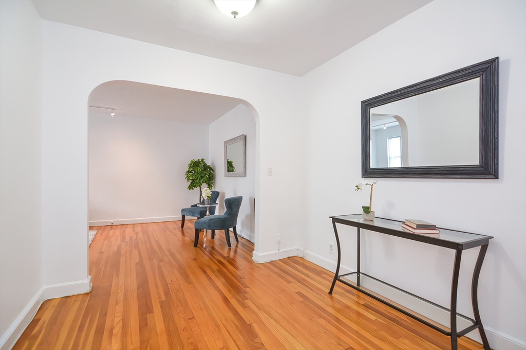 40 Browne Street, Unit 5 Brookline, MA 02446 - Photo 3 of 39 a view of a livingroom with furniture and wooden floor