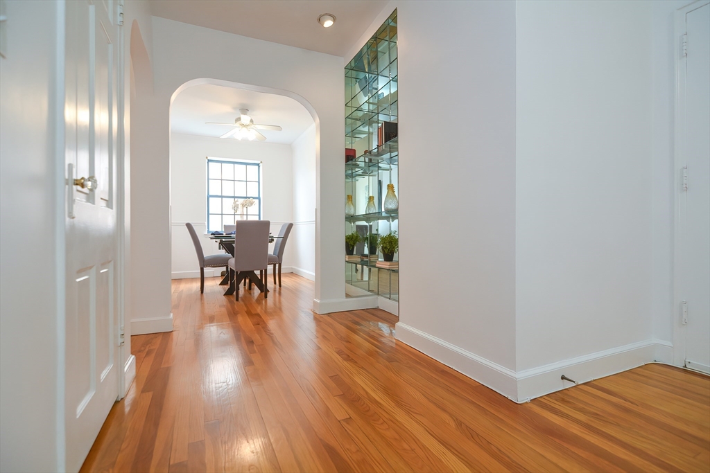 40 Browne Street, Unit 5 Brookline, MA 02446 - Photo 9 of 39 a view of a livingroom with furniture and wooden floor