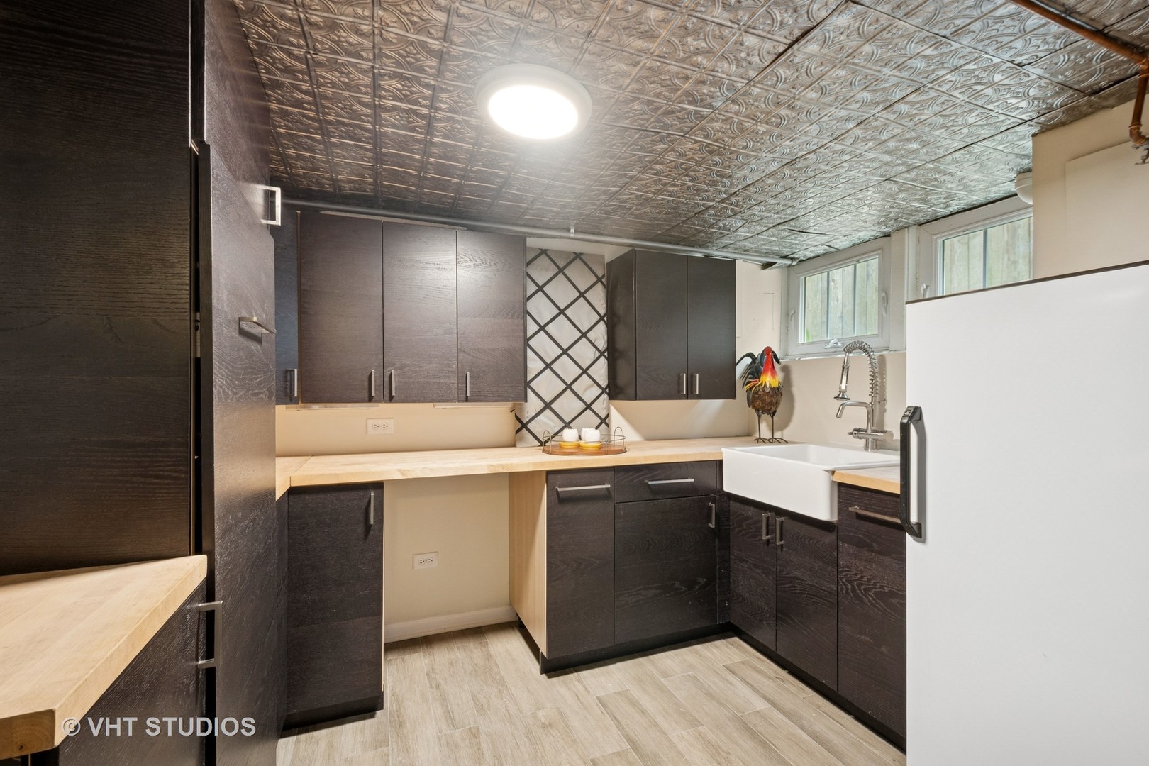 868 Sheridan Road Evanston, IL 60202 - Photo 27 of 39 a kitchen with a sink cabinets and wooden floor