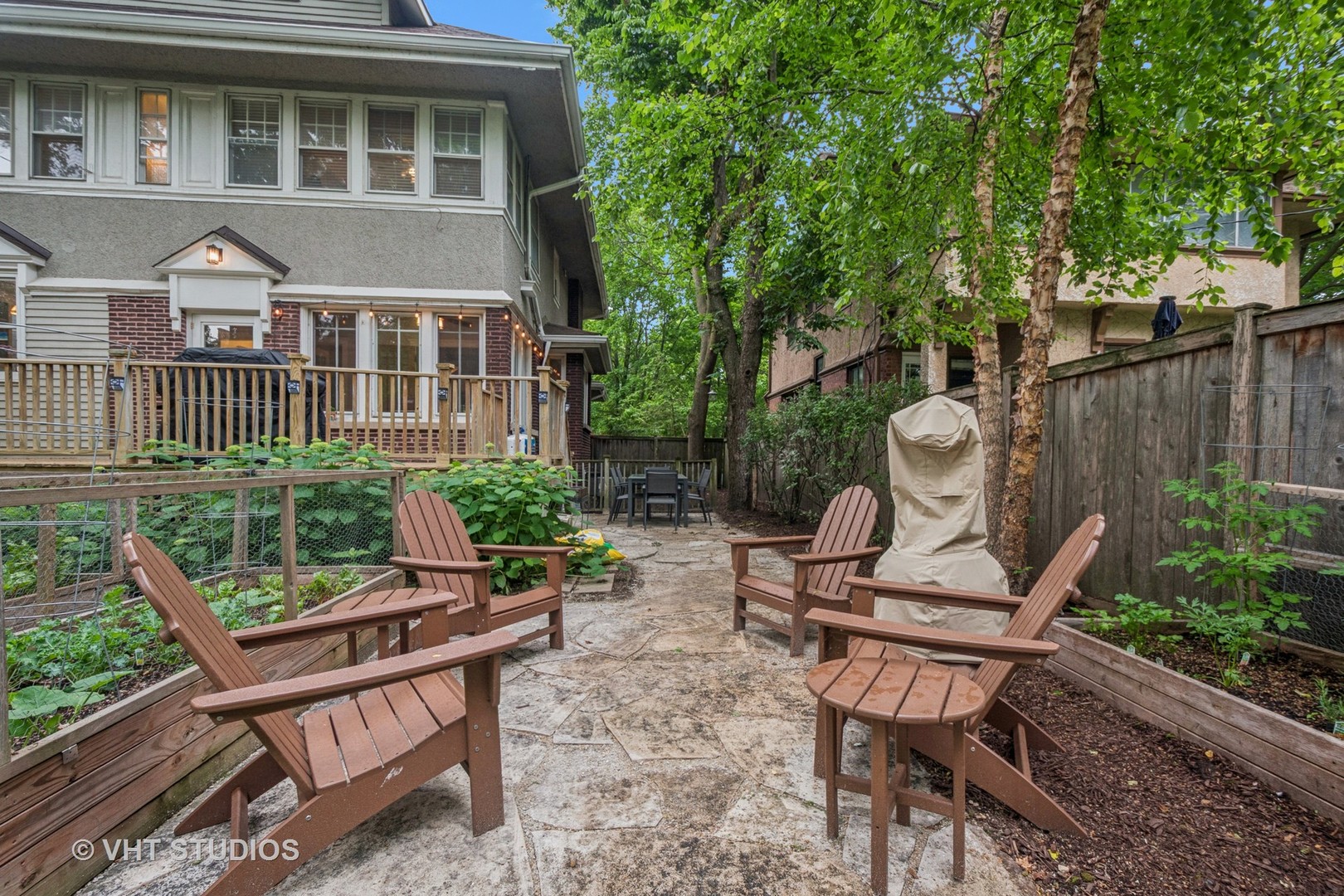 868 Sheridan Road Evanston, IL 60202 - Photo 33 of 39 a view of a patio with table and chairs and wooden fence