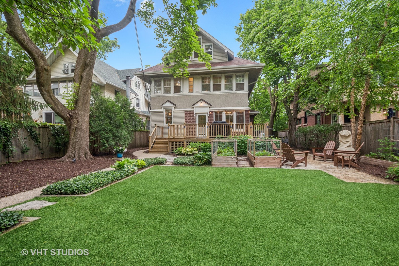868 Sheridan Road Evanston, IL 60202 - Photo 34 of 39 a front view of a house with a garden and patio