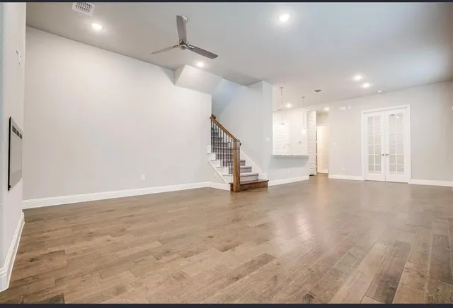 a view of an empty room with stairs