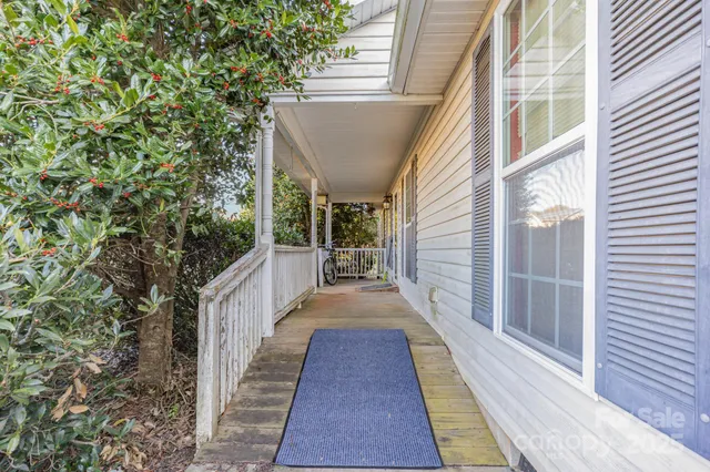 a view of a balcony with wooden floor and floor