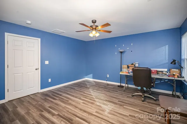 a workspace with chandelier fan