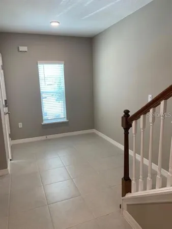 a view of a livingroom with a staircase