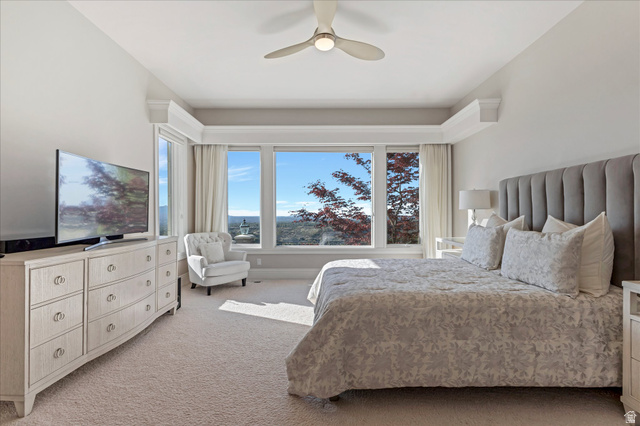 3222 Eagle View Circle Sandy, UT 84092 - Photo 29 of 60 Bedroom with light carpet, multiple windows, and ceiling fan