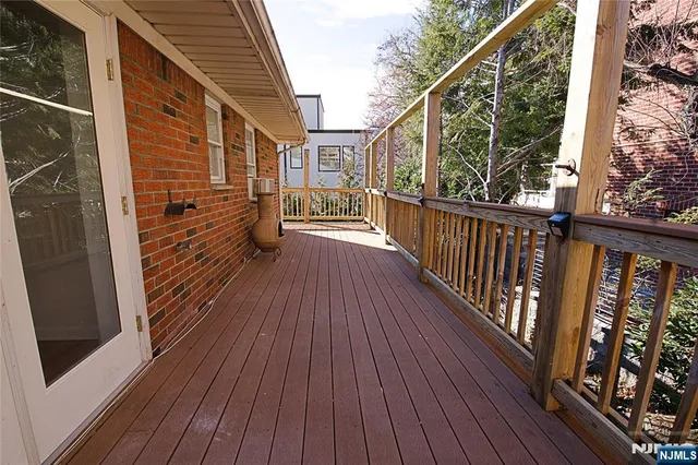 a view of balcony with wooden floor