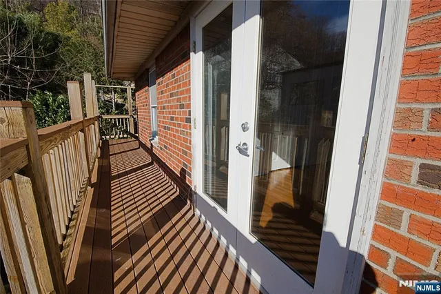 a view of balcony and wooden floor
