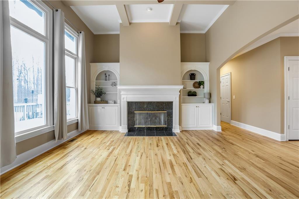 803 Rocky Ridge Court Canton, GA 30114 - Photo 11 of 80 a view of a livingroom with wooden floor and a fireplace