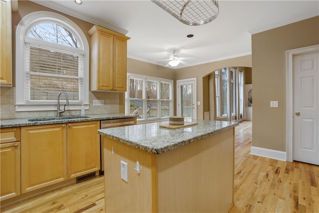 803 Rocky Ridge Court Canton, GA 30114 - Photo 16 of 80 a kitchen with stainless steel appliances granite countertop a sink and a window