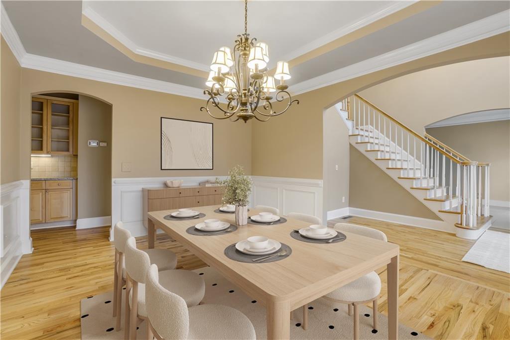 803 Rocky Ridge Court Canton, GA 30114 - Photo 25 of 80 a view of a dining room with furniture a chandelier and wooden floor