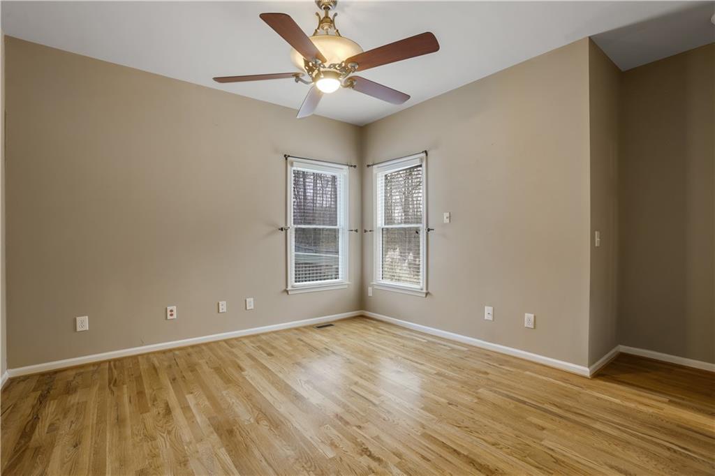 803 Rocky Ridge Court Canton, GA 30114 - Photo 28 of 80 an empty room with wooden floor and windows