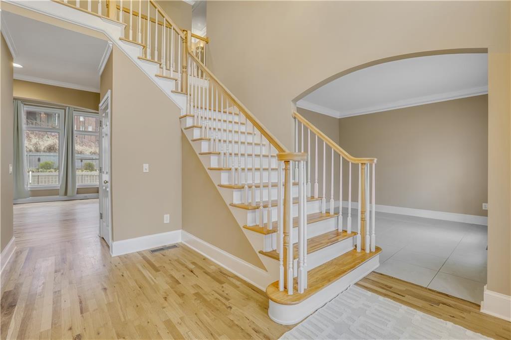 803 Rocky Ridge Court Canton, GA 30114 - Photo 5 of 80 a view of entryway with wooden floor and stairs