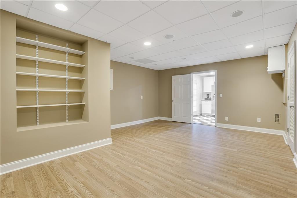 803 Rocky Ridge Court Canton, GA 30114 - Photo 70 of 80 a view of an empty room with a window and wooden floor