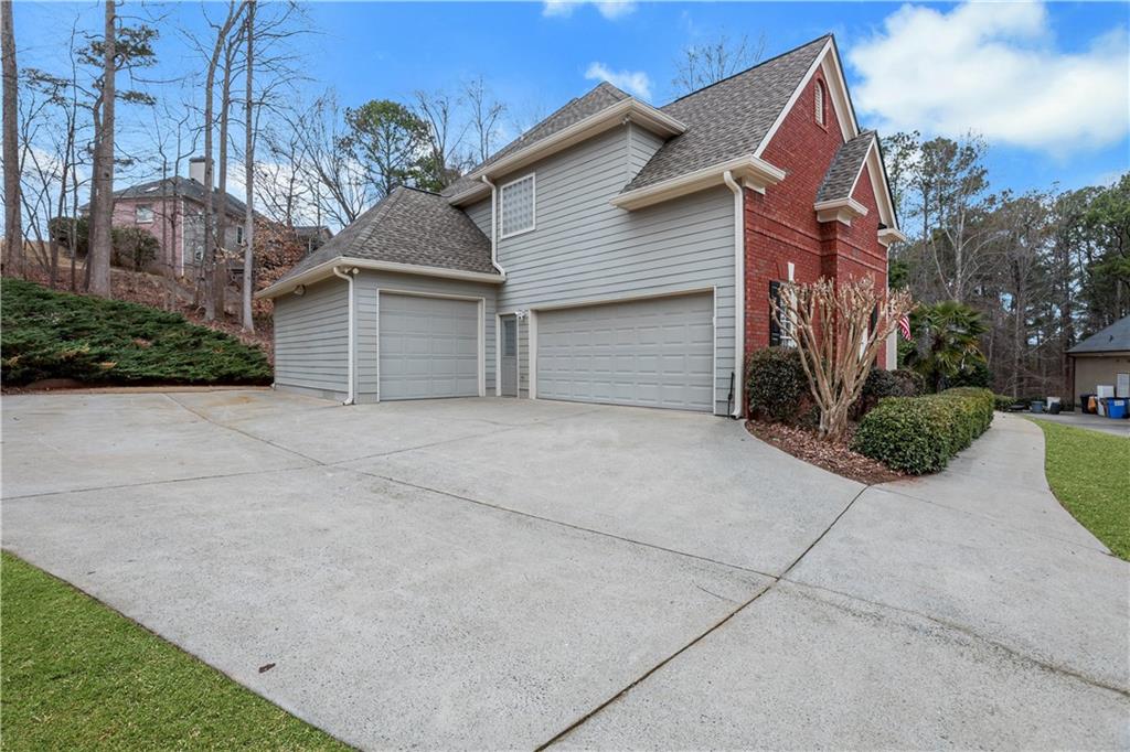 803 Rocky Ridge Court Canton, GA 30114 - Photo 73 of 80 a view of a house with a yard and potted plants