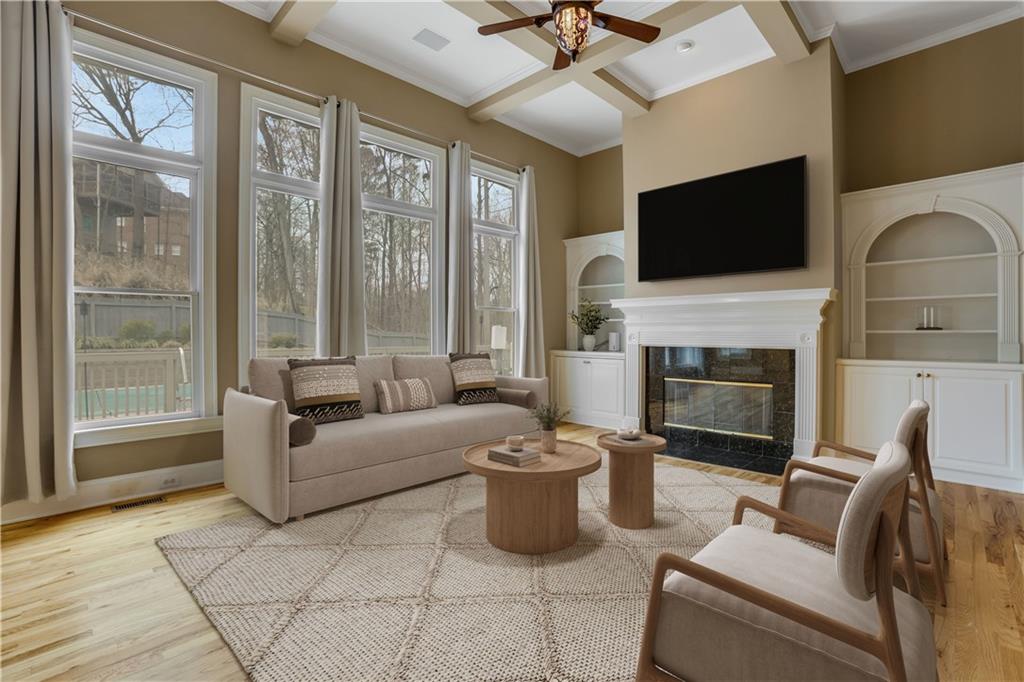 803 Rocky Ridge Court Canton, GA 30114 - Photo 8 of 80 a living room with furniture a fireplace and a flat screen tv
