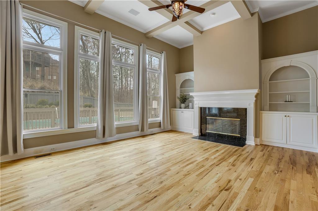 803 Rocky Ridge Court Canton, GA 30114 - Photo 9 of 80 a view of empty room with fireplace and fan