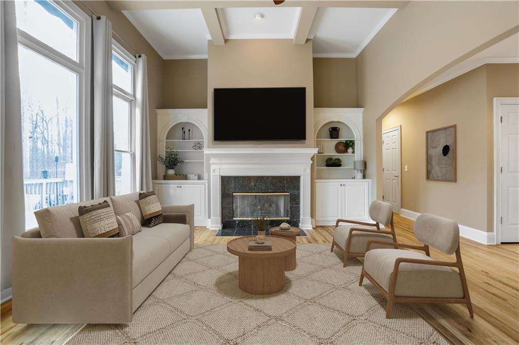 803 Rocky Ridge Court Canton, GA 30114 - Photo 10 of 80 a living room with furniture a flat screen tv and a fireplace