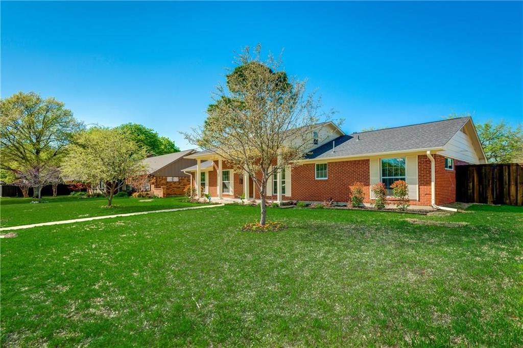 10216 Carry Back Circle Dallas, TX 75229 - Photo 27 of 28 a front view of a house with a yard