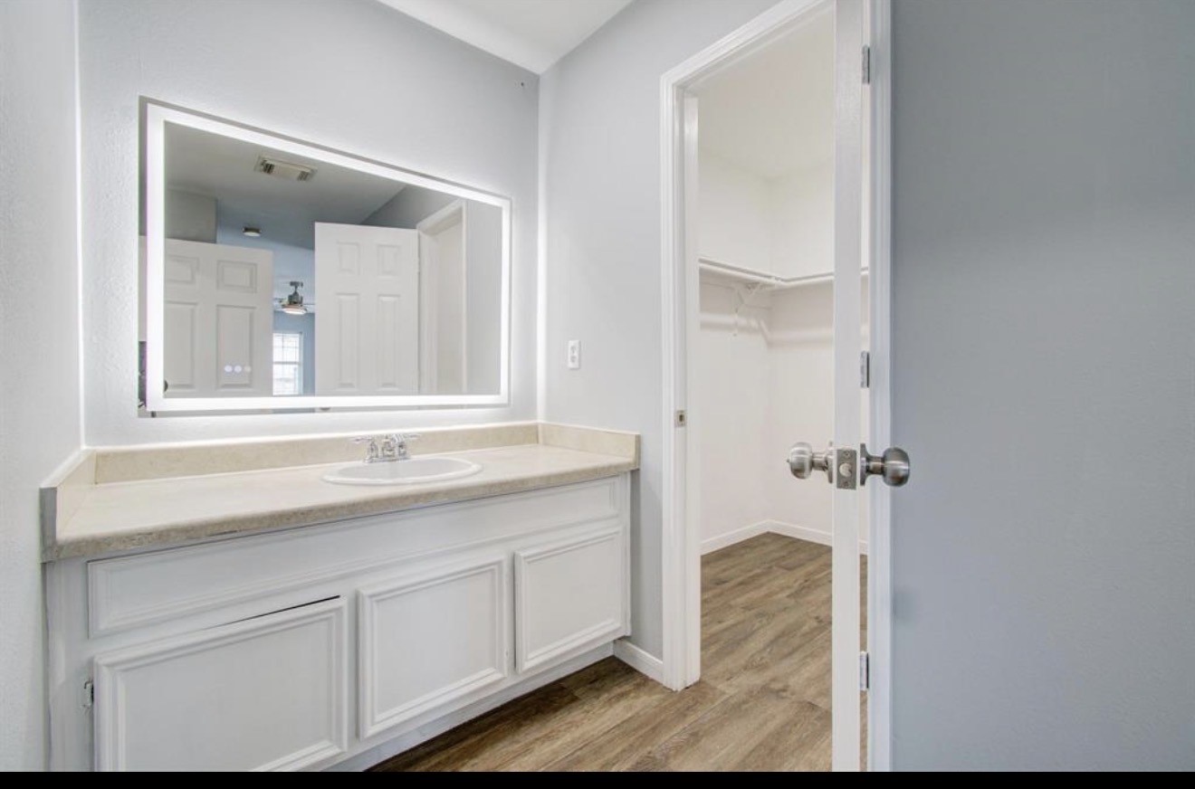 3131 Chaffin Street Houston, TX 77087 - Photo 9 of 11 a bathroom with a sink and mirror