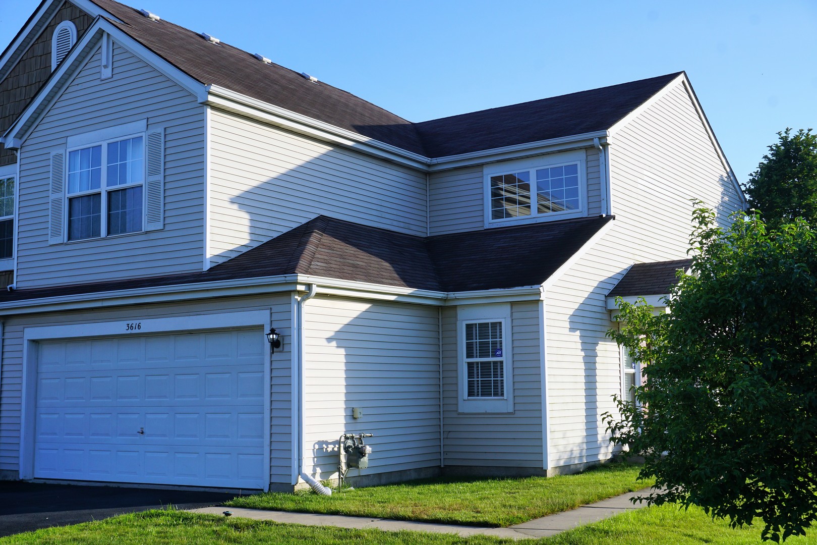 3616 Forestview Drive, Unit 3616 Joliet, IL 60431 - Photo 1 of 20 a front view of a house with a yard