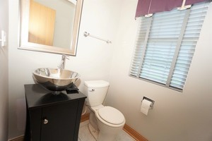 3616 Forestview Drive, Unit 3616 Joliet, IL 60431 - Photo 12 of 20 a bathroom with a toilet sink and mirror