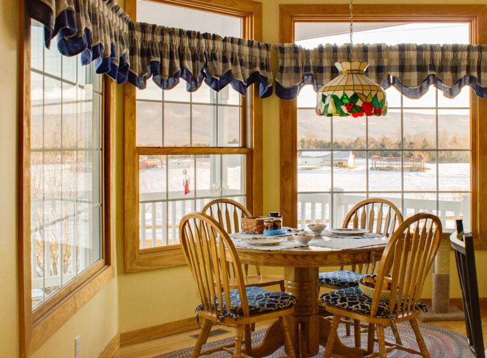 713 Lantz Road Edinburg, VA 22824 - Photo 15 of 27 a view of a dining room with furniture window and outside view