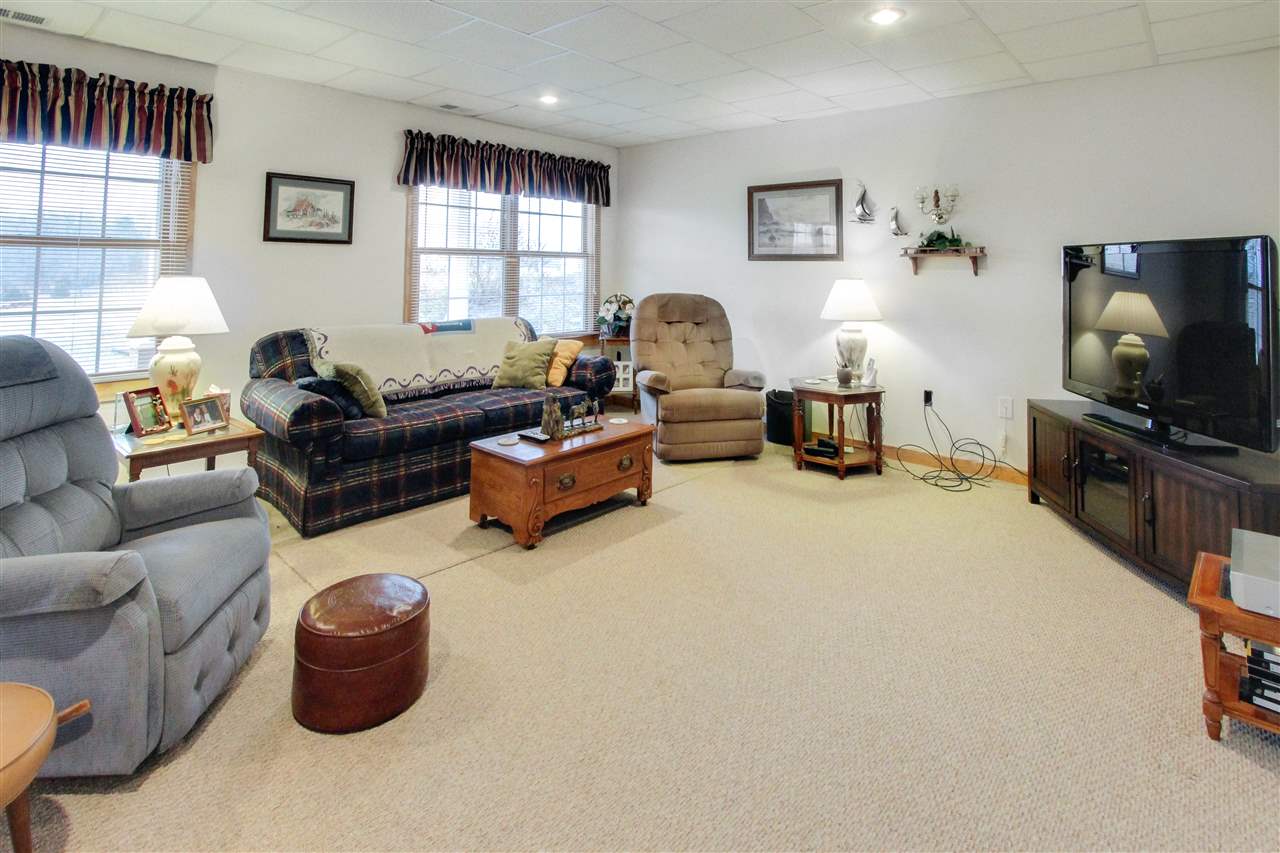 713 Lantz Road Edinburg, VA 22824 - Photo 23 of 27 a living room with furniture and a flat screen tv