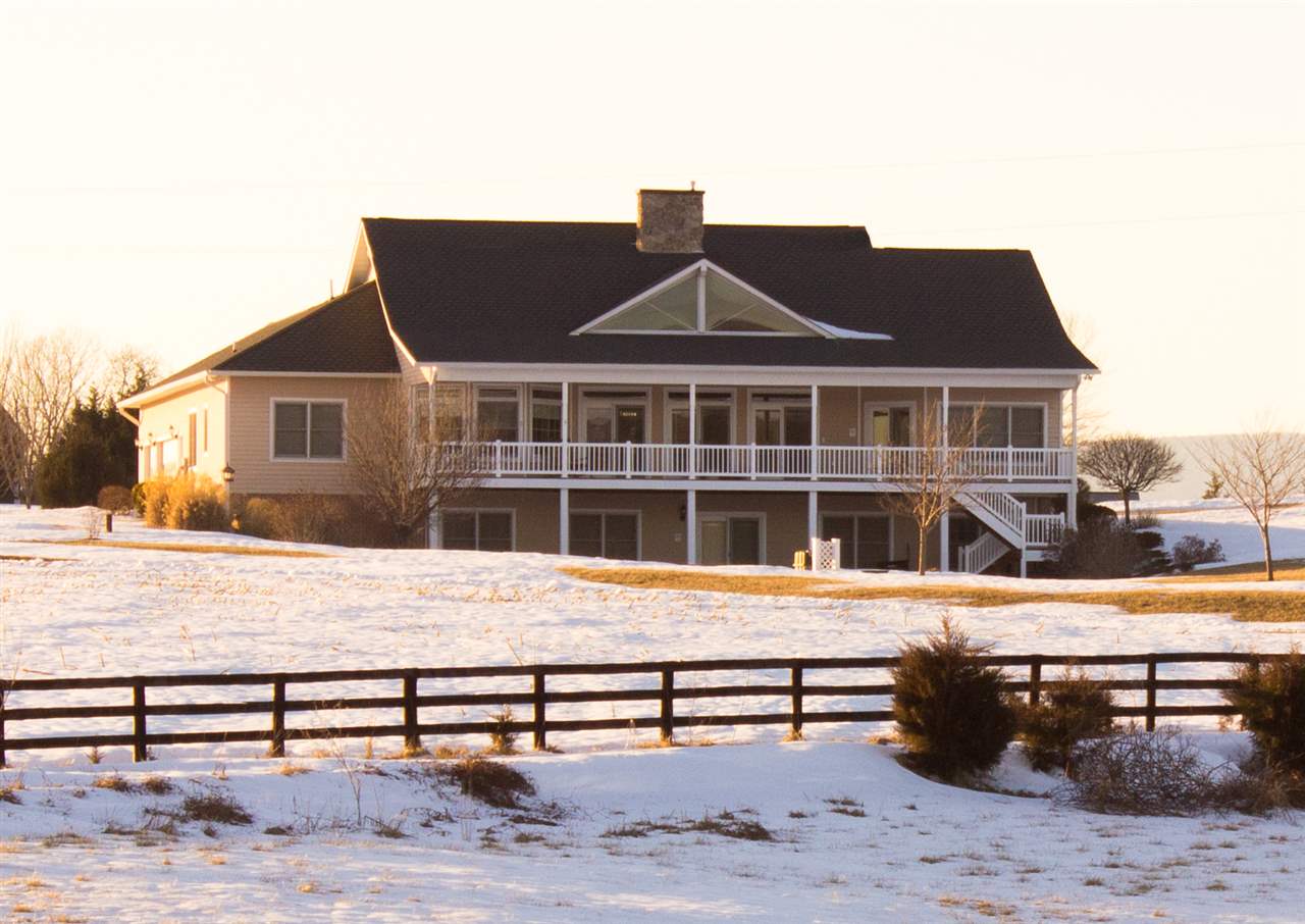 713 Lantz Road Edinburg, VA 22824 - Photo 4 of 27 a front view of a house with a wooden fence