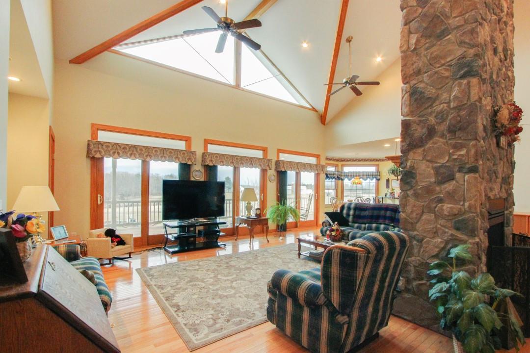 713 Lantz Road Edinburg, VA 22824 - Photo 9 of 27 a living room with furniture and a flat screen tv
