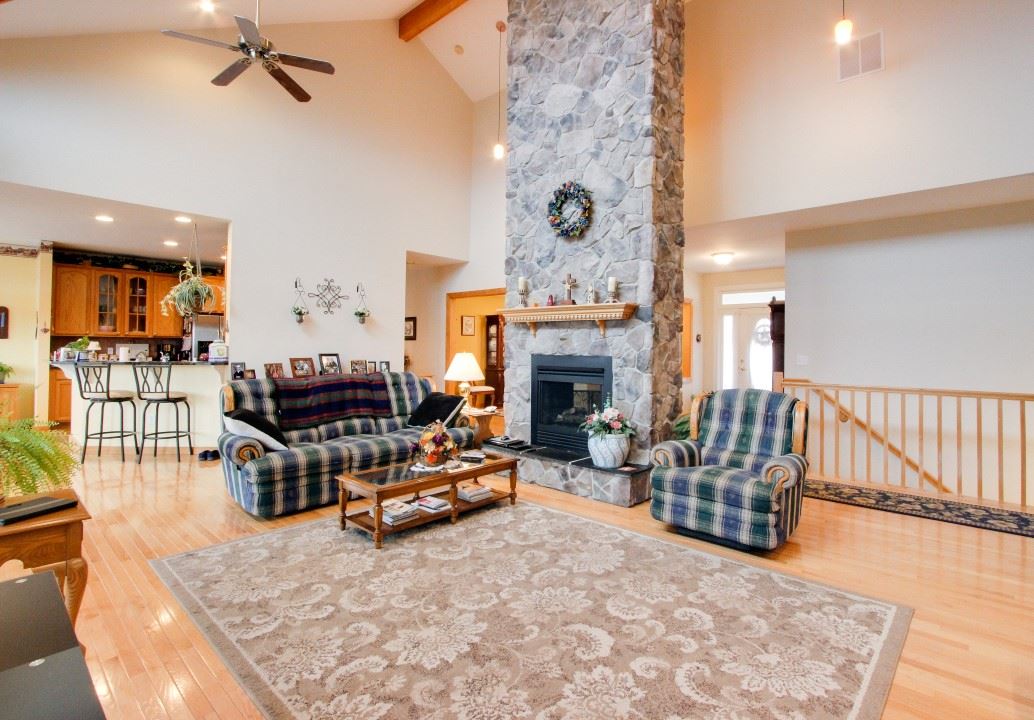 713 Lantz Road Edinburg, VA 22824 - Photo 10 of 27 a living room with furniture and a fireplace