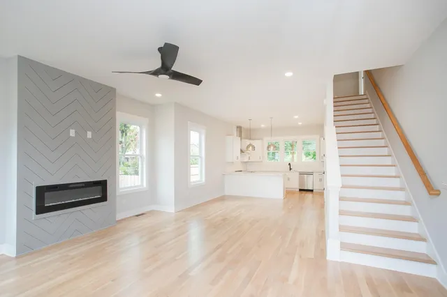 a view of a kitchen with a sink a refrigerator and window