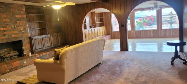 a living room with furniture and a fireplace