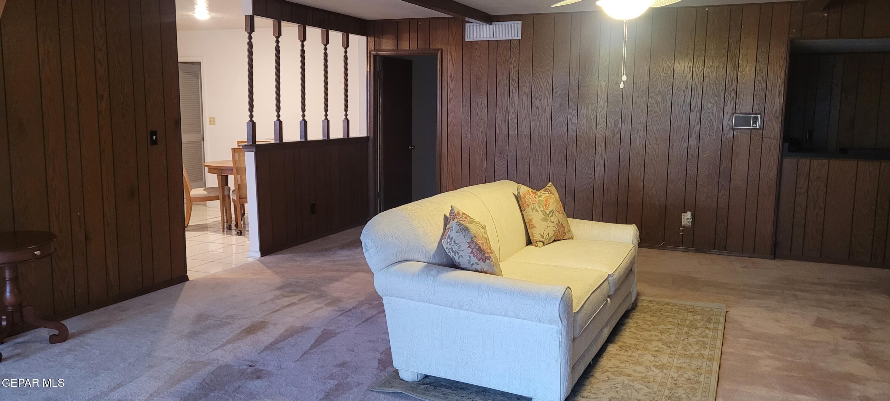 3125 Stone Edge Road El Paso, TX 79904 - Photo 13 of 18 a living room with furniture and a wooden door