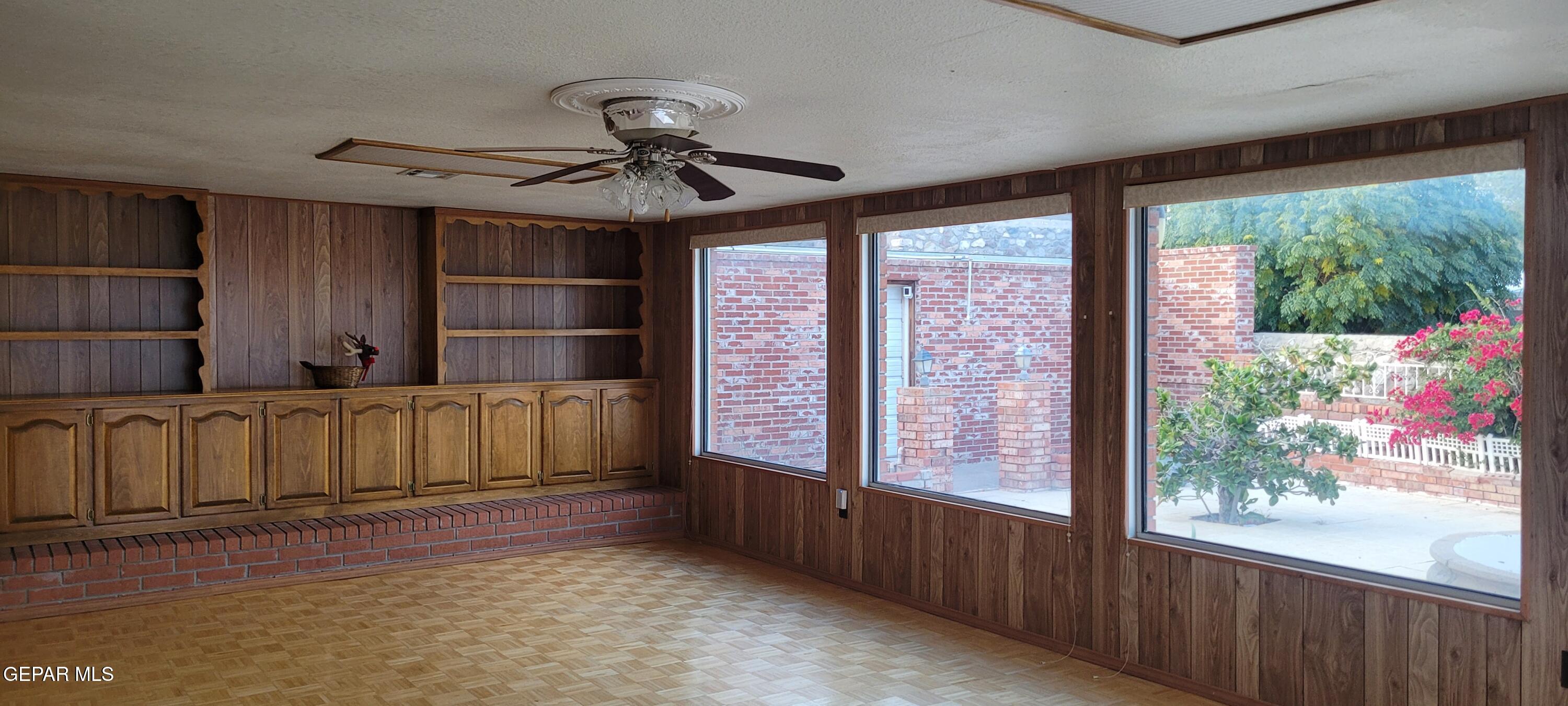 3125 Stone Edge Road El Paso, TX 79904 - Photo 16 of 18 a view of a kitchen with furniture large window and wooden floor