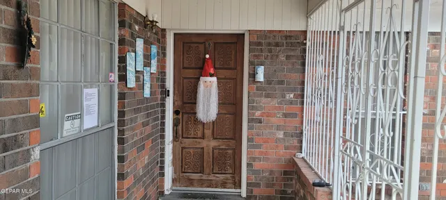 a view of a wooden door with a glass door