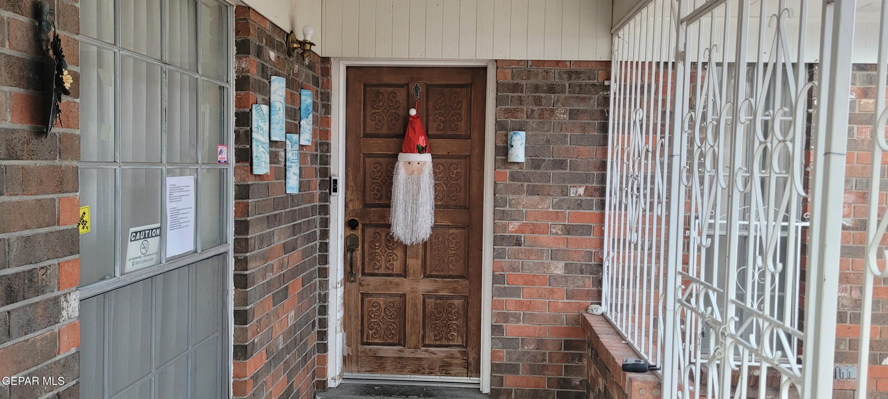 3125 Stone Edge Road El Paso, TX 79904 - Photo 2 of 18 a view of a wooden door with a glass door