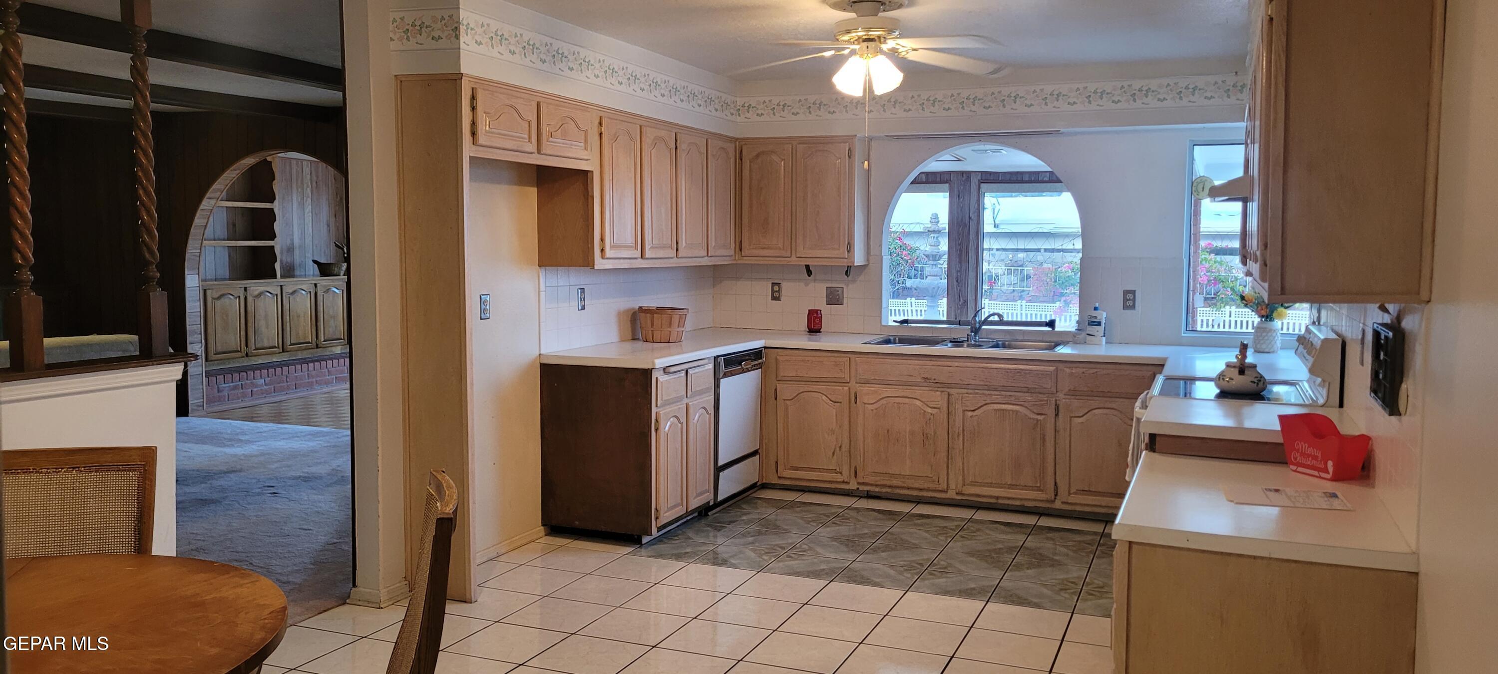 3125 Stone Edge Road El Paso, TX 79904 - Photo 6 of 18 a view of a kitchen with a sink and cabinets