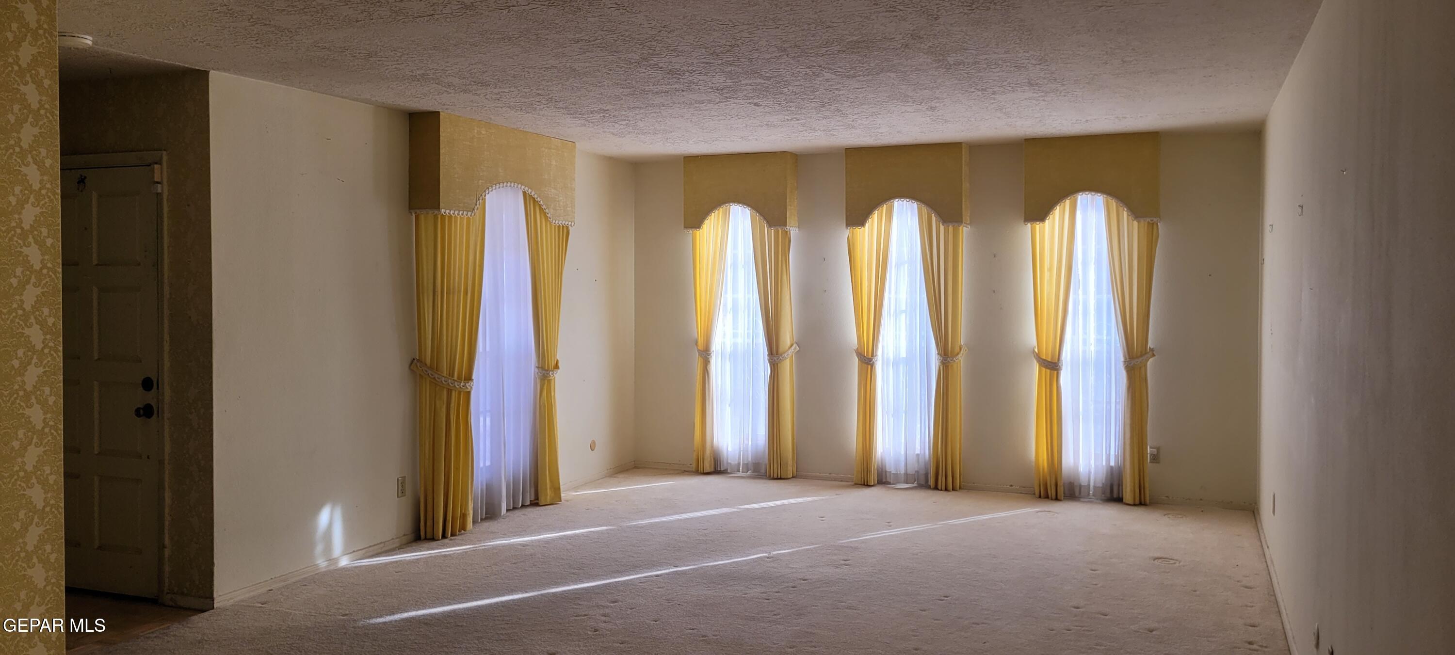 3125 Stone Edge Road El Paso, TX 79904 - Photo 7 of 18 a view of room with windows and closet