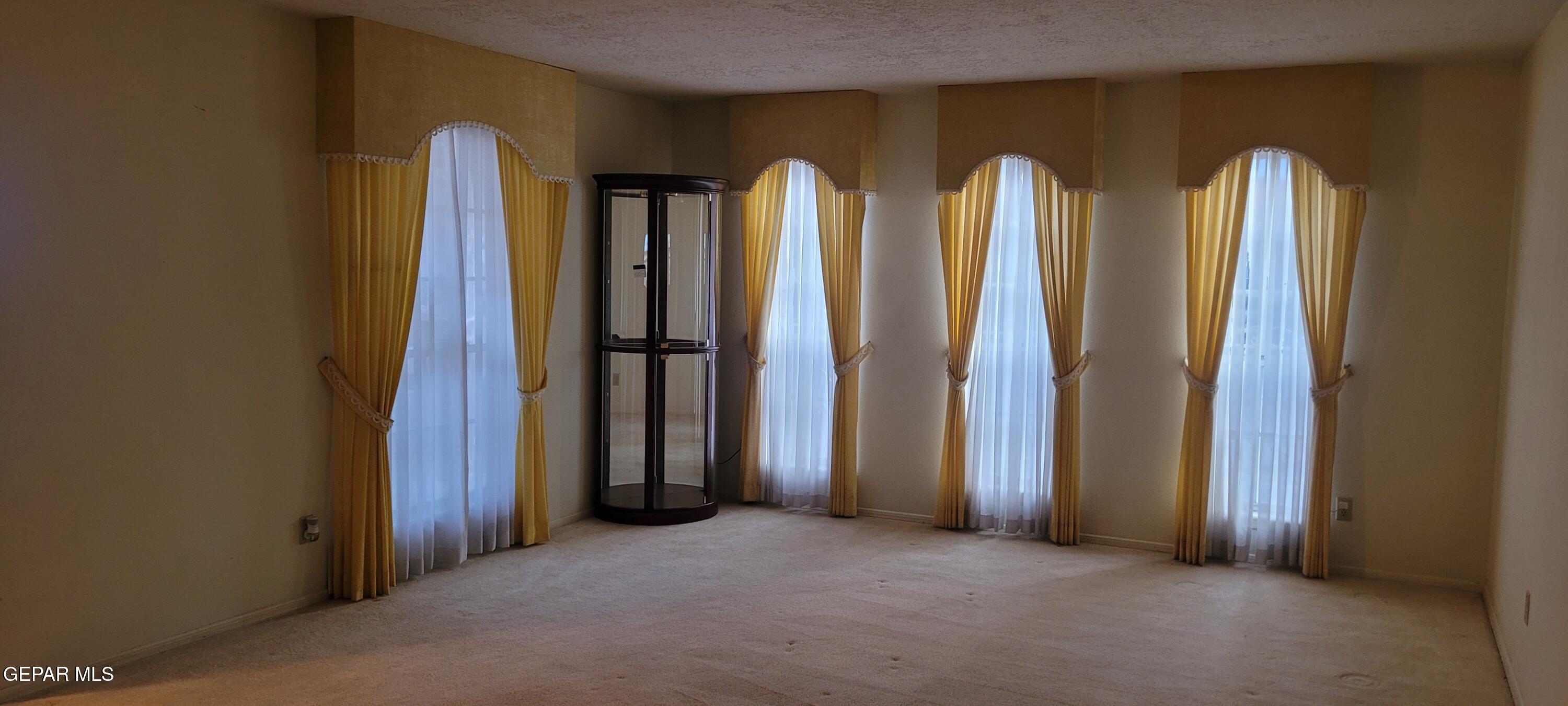 3125 Stone Edge Road El Paso, TX 79904 - Photo 8 of 18 a view of a room with windows and closet