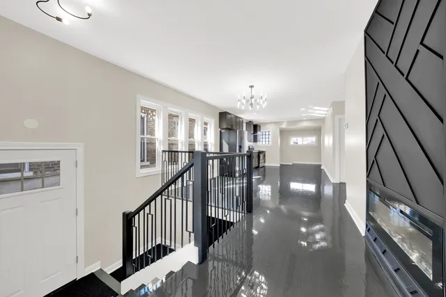 a view of a livingroom with furniture and staircase