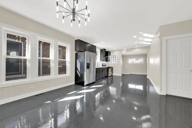 a view of a hallway with windows