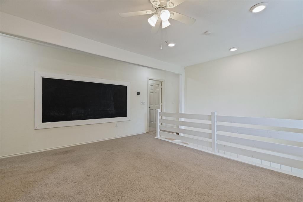5455-924 County Road Nevada, TX 75173 - Photo 7 of 14 Recessed lighting, ceiling fan, built-in chalkboard, interior railing, and neutral carpeting